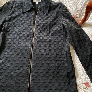 St John womens Black jacket. Gold zipper and name tag. Dry clean only.